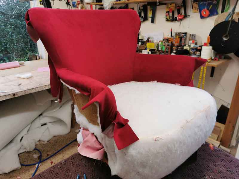 Reupholstering red arm chair