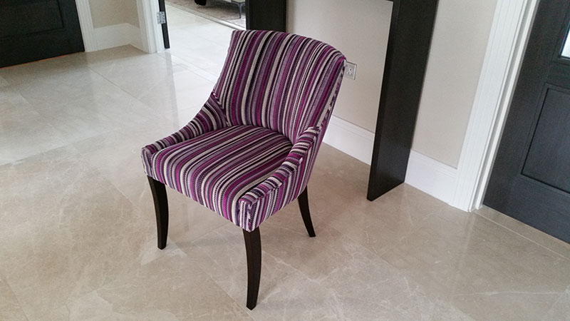 Reupholstered striped armless chair