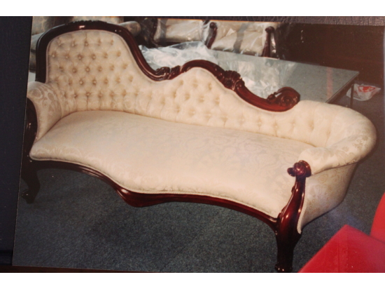Antique chaise longue sporting new upholstery