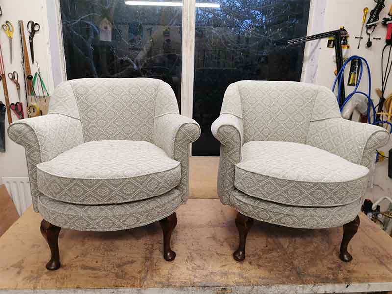 Reupholstered arm chairs
