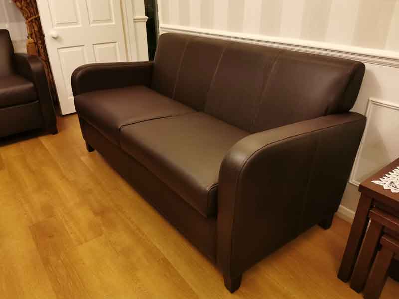 Reupholstered leather sofa