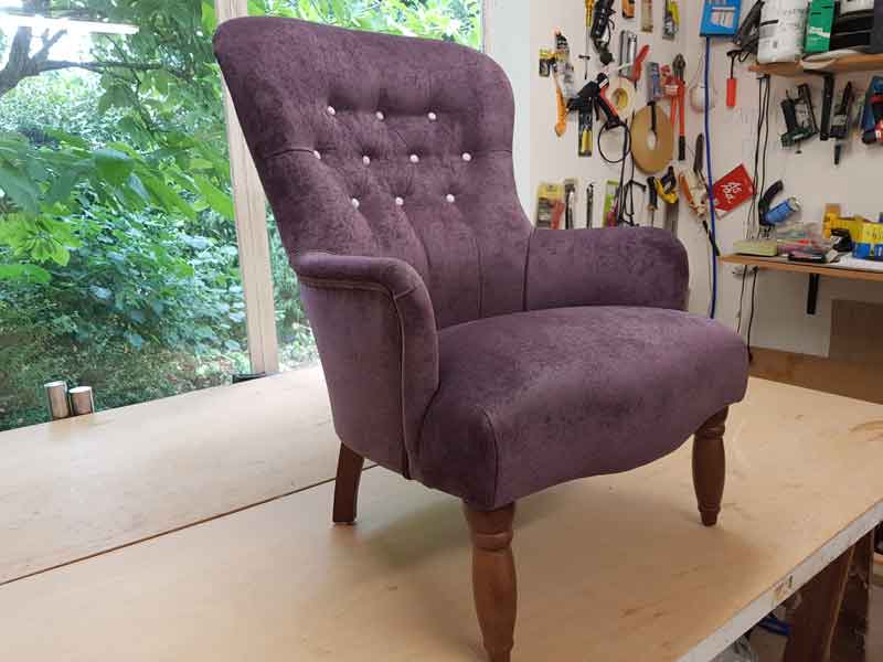 Reupholstered plum arm chair