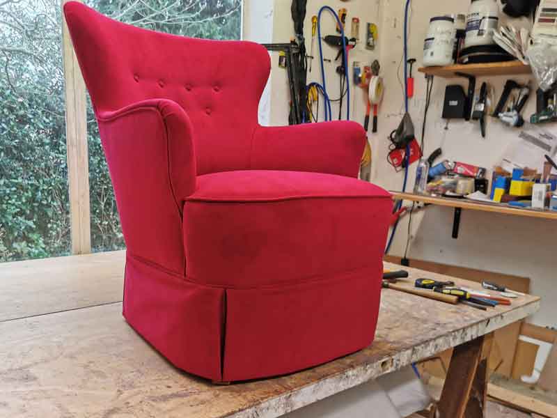 Reupholstered red arm chair